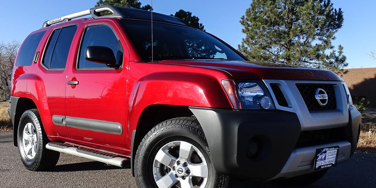 Nissan SUV red on sunny afternoon Bad Credit Auto Broker Denver
